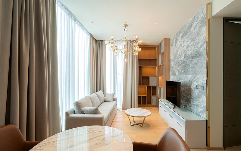 Elegant beige drapes in a modern luxury HDB living room.