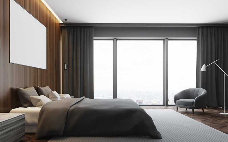 Modern bedroom featuring floor-to-ceiling charcoal curtains, a trending Singapore style.
